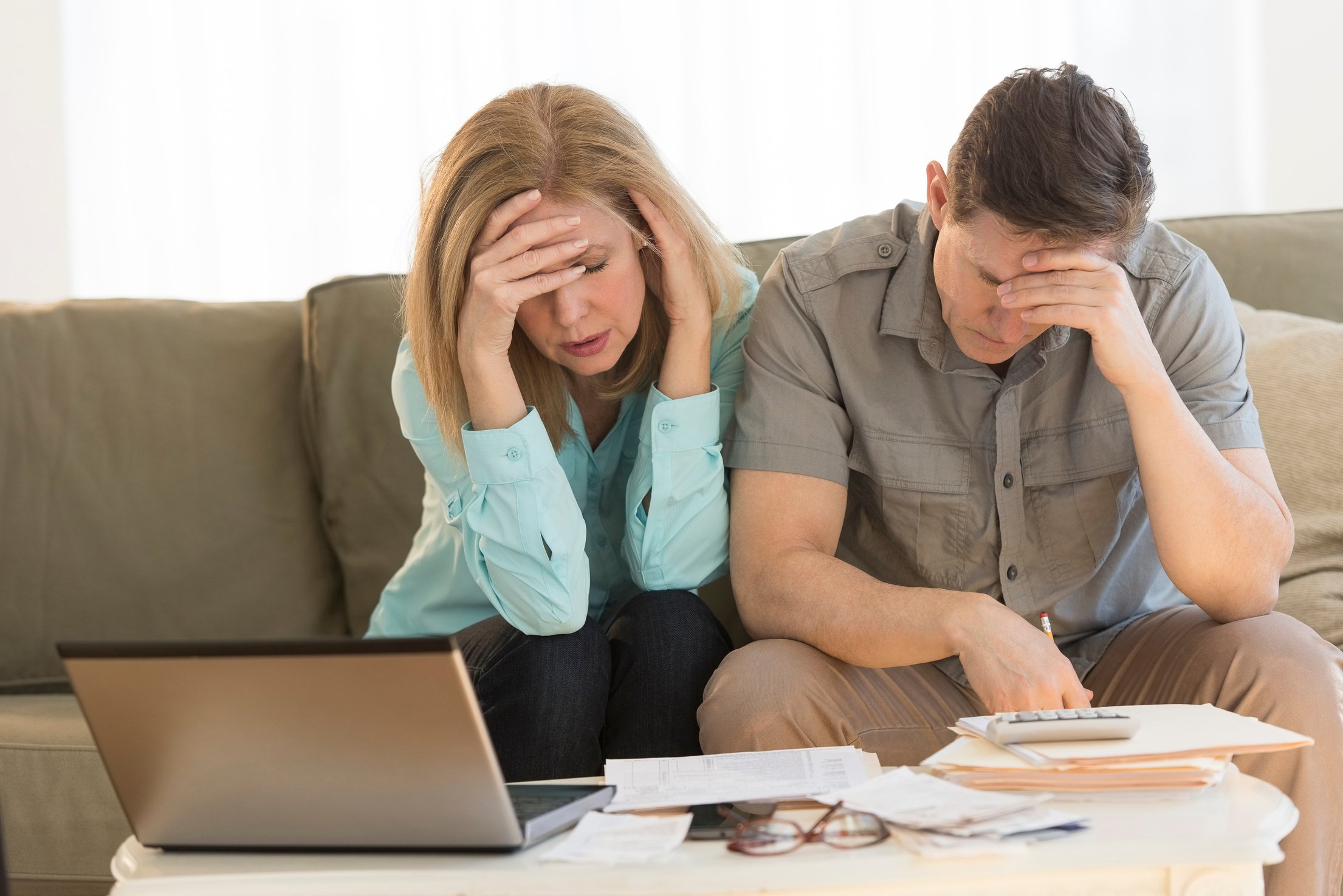 Worried Mature Couple Calculating Home Finances